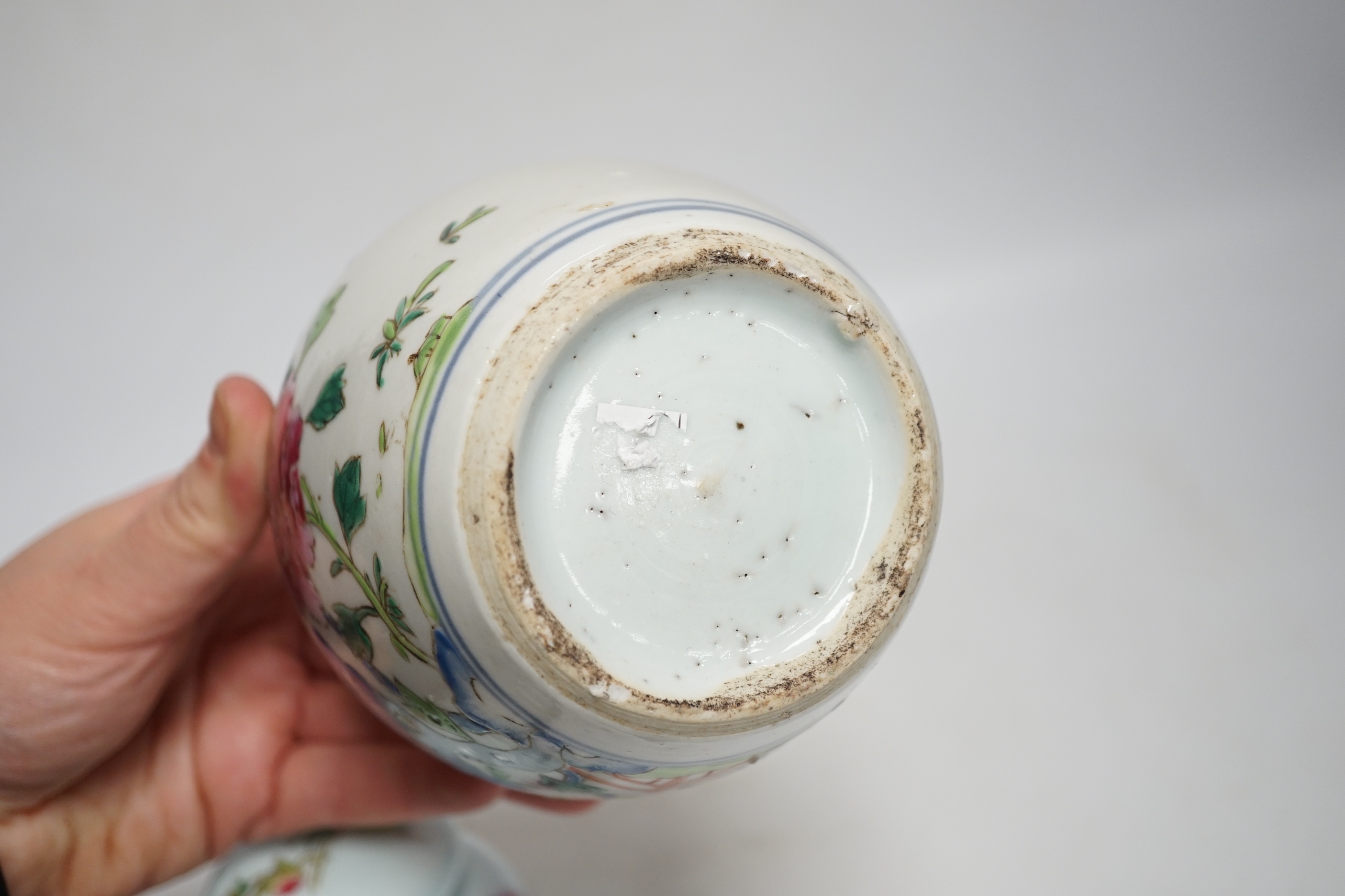 A collection of Chinese ceramics including celadon bowl decorated in low relief with fish, famille rose tea bowls and a jar, largest 12cm high